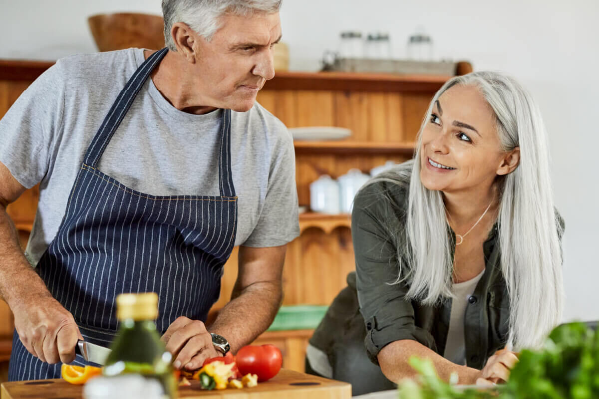 55+ couple cooking